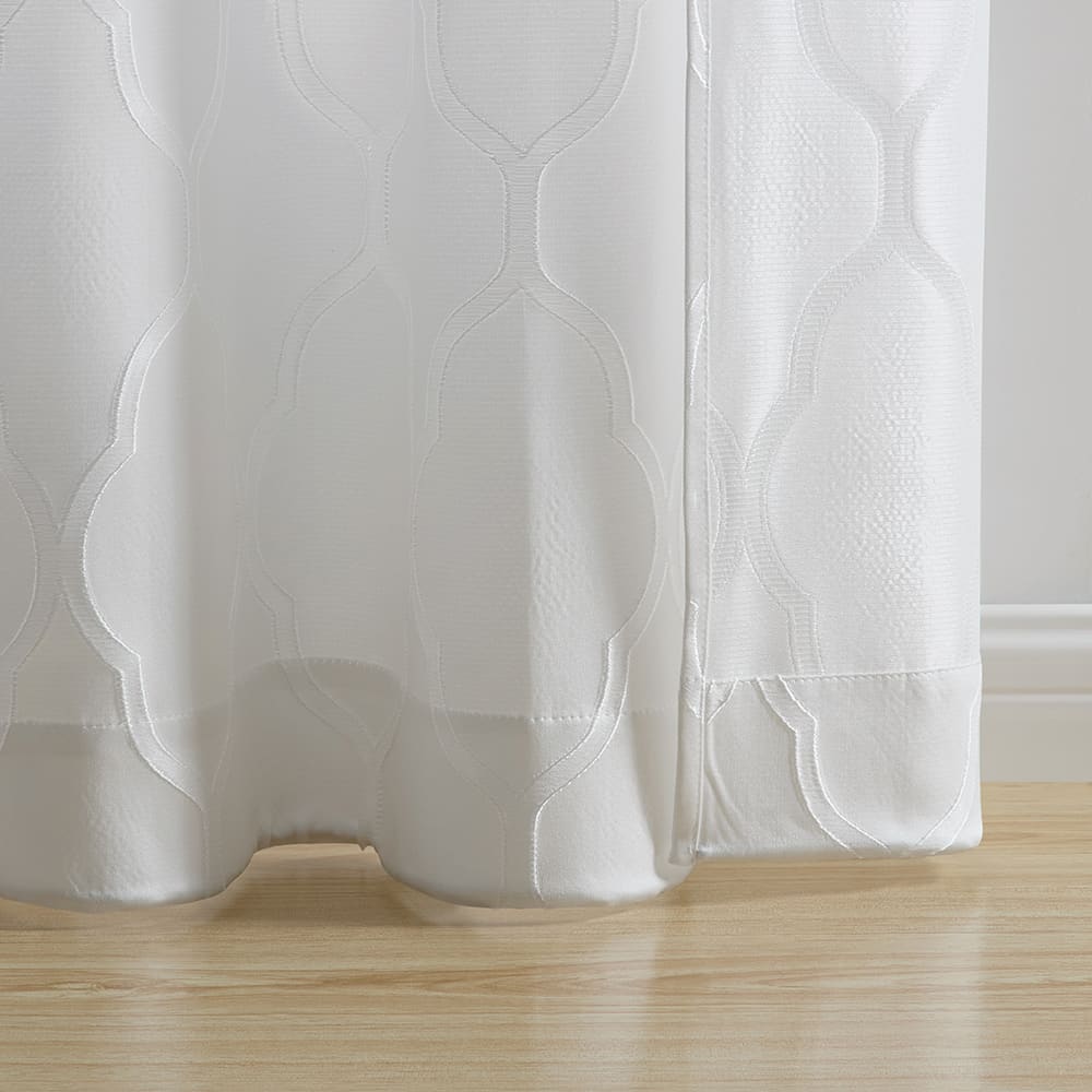 The bottom of a Luna Lattice white panel where it meets the floor