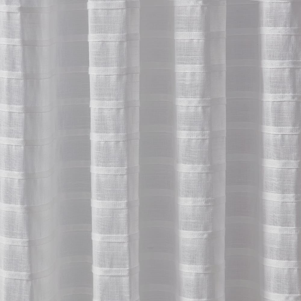 The folds of a Pleated Stripe white panel, close up