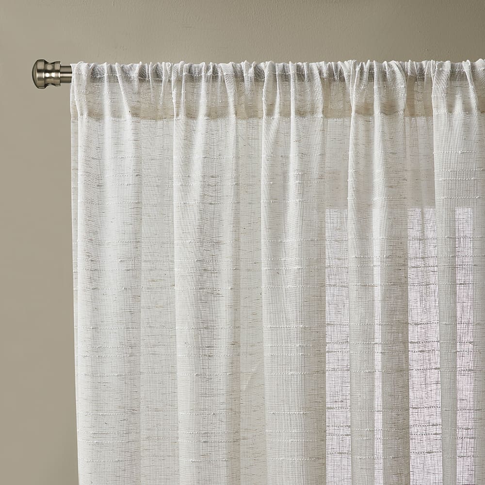 Close-up of the top of a Sasha linen panel on its rod